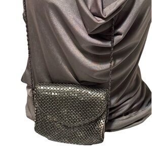 vintage-style black mesh evening bag with a metallic chain strap.